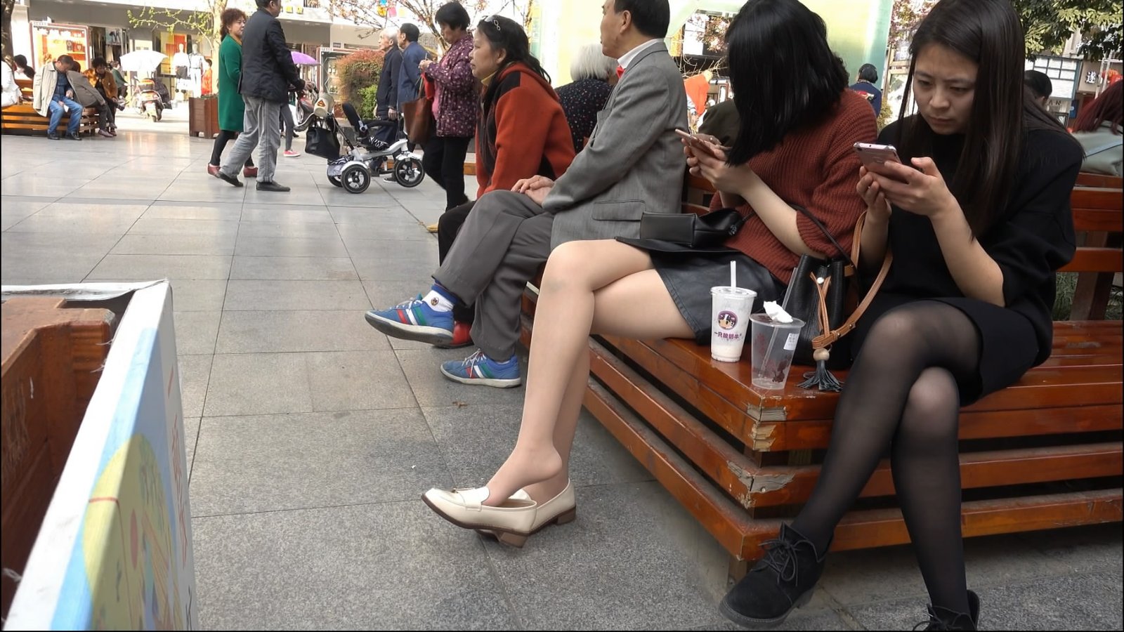 Dangling Woman Focused Phone and Ignore Her Legs